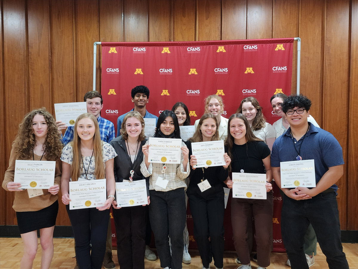 A group of students pose with their Borlaug Scholar certificates at the recognition ceremony