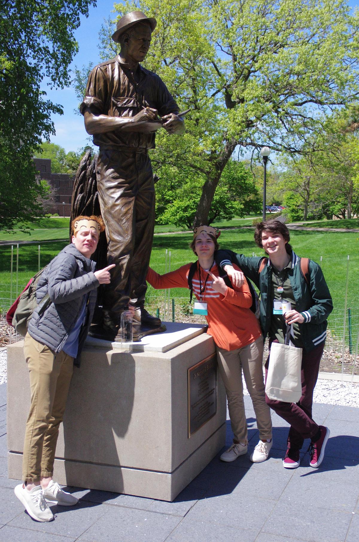 Students with Norman Borlaug Statue